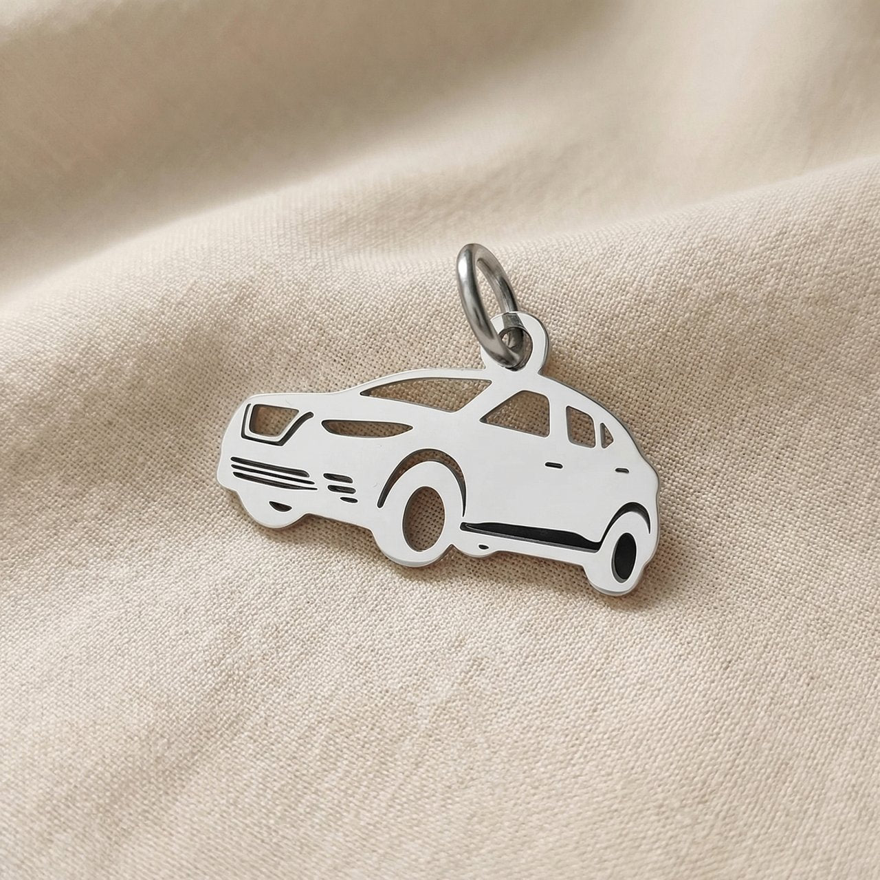 Silver SUV charm for keyring symbolizing travel adventures, family road trips, and meaningful driving memories