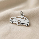 Silver SUV charm for keyring symbolizing travel adventures, family road trips, and meaningful driving memories