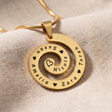 Swirl of time necklace in gold with engraved symbolic design, meaningful keepsake jewellery gift