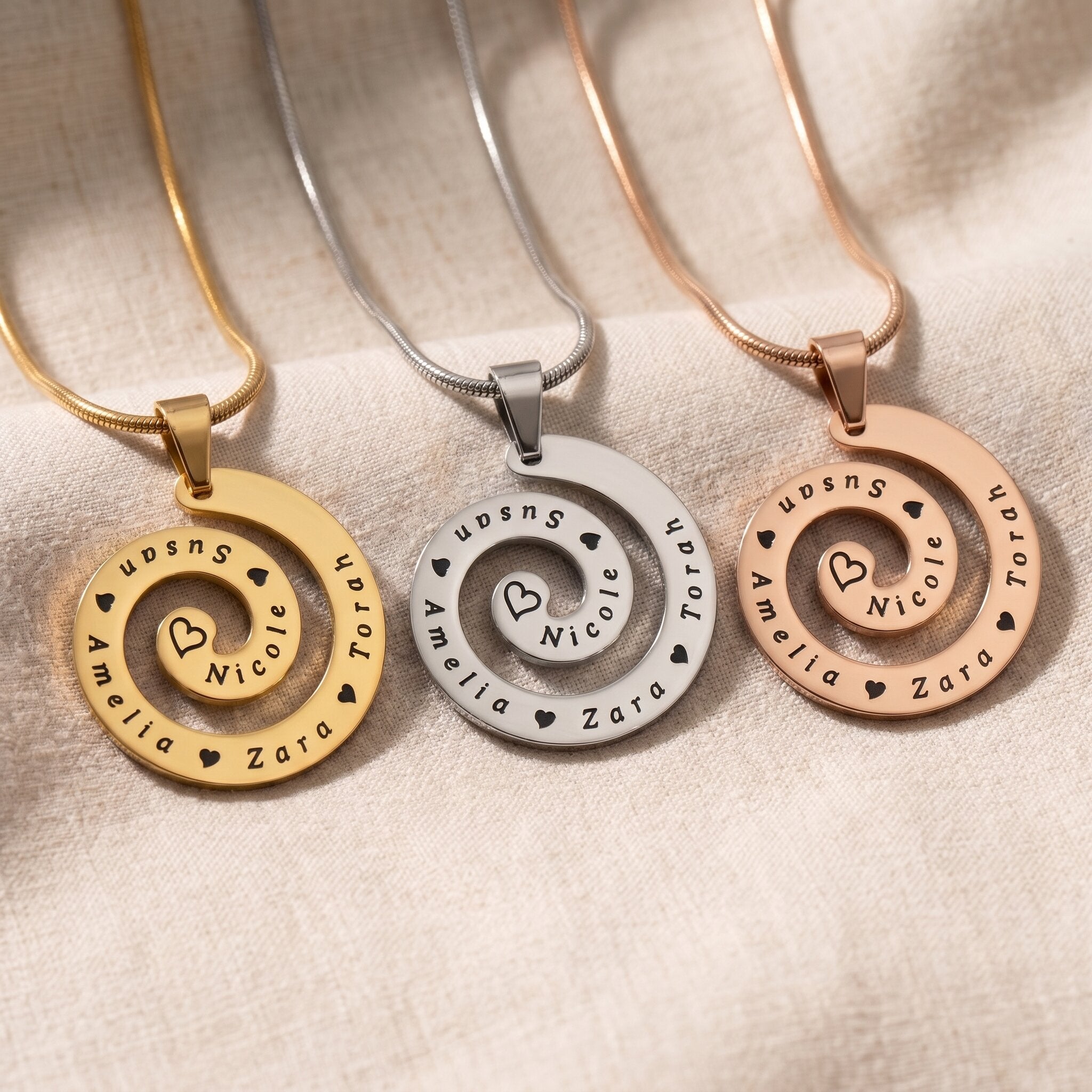 Swirl of time necklace tone comparison showing gold, silver and rose gold keepsake jewellery finishes