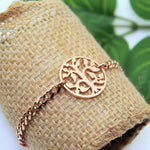 Belle Fever rose gold Tree of Life charm bracelet, symbol of growth and connection.