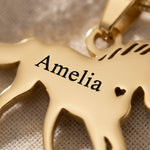 Close-up of unicorn name necklace with engraved name and unicorn silhouette detail