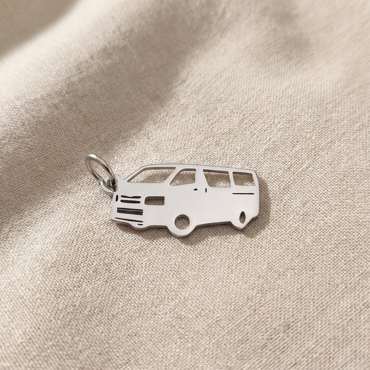 Silver people mover van charm for keyring symbolizing family travel, road trips, and shared life memories