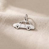 Silver vintage car charm for keyring symbolizing classic car passion, nostalgia, and timeless travel memories